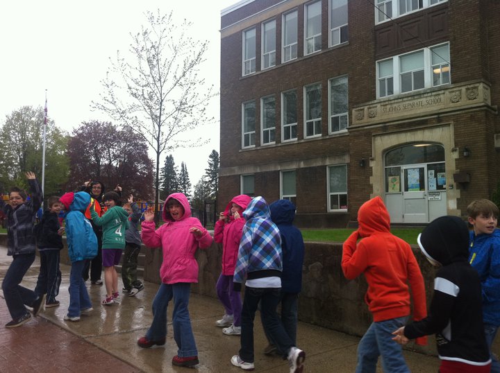 Heading out with students at St. John's in the rain for a walk around the neighbourhood!